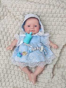 MYREBABY open-eyes doll in blue clothes feels lifelike and inviting.