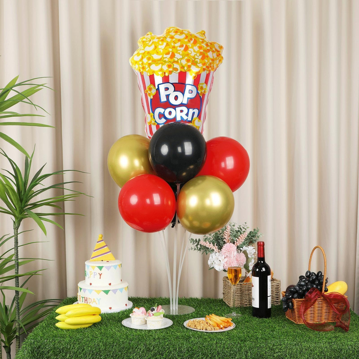 Naozinebi star foil balloon accents the red, black, gold palette