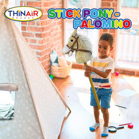 Nature Bound child playing with stick horse during active pretend play.