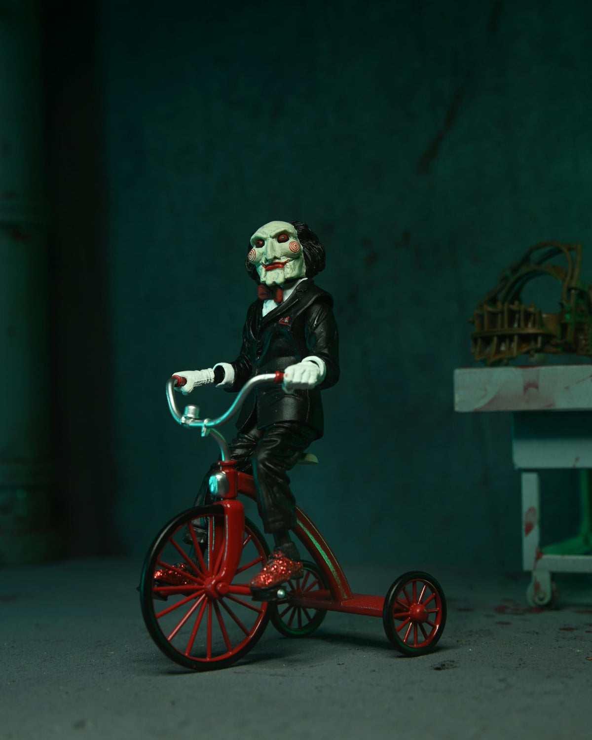 NECA Billy puppet with Trike completes the collectible display narrative.