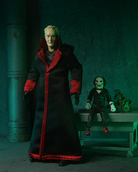 NECA Saw Ultimate Jigsaw Killer figure interchangeable heads for varied expressions.