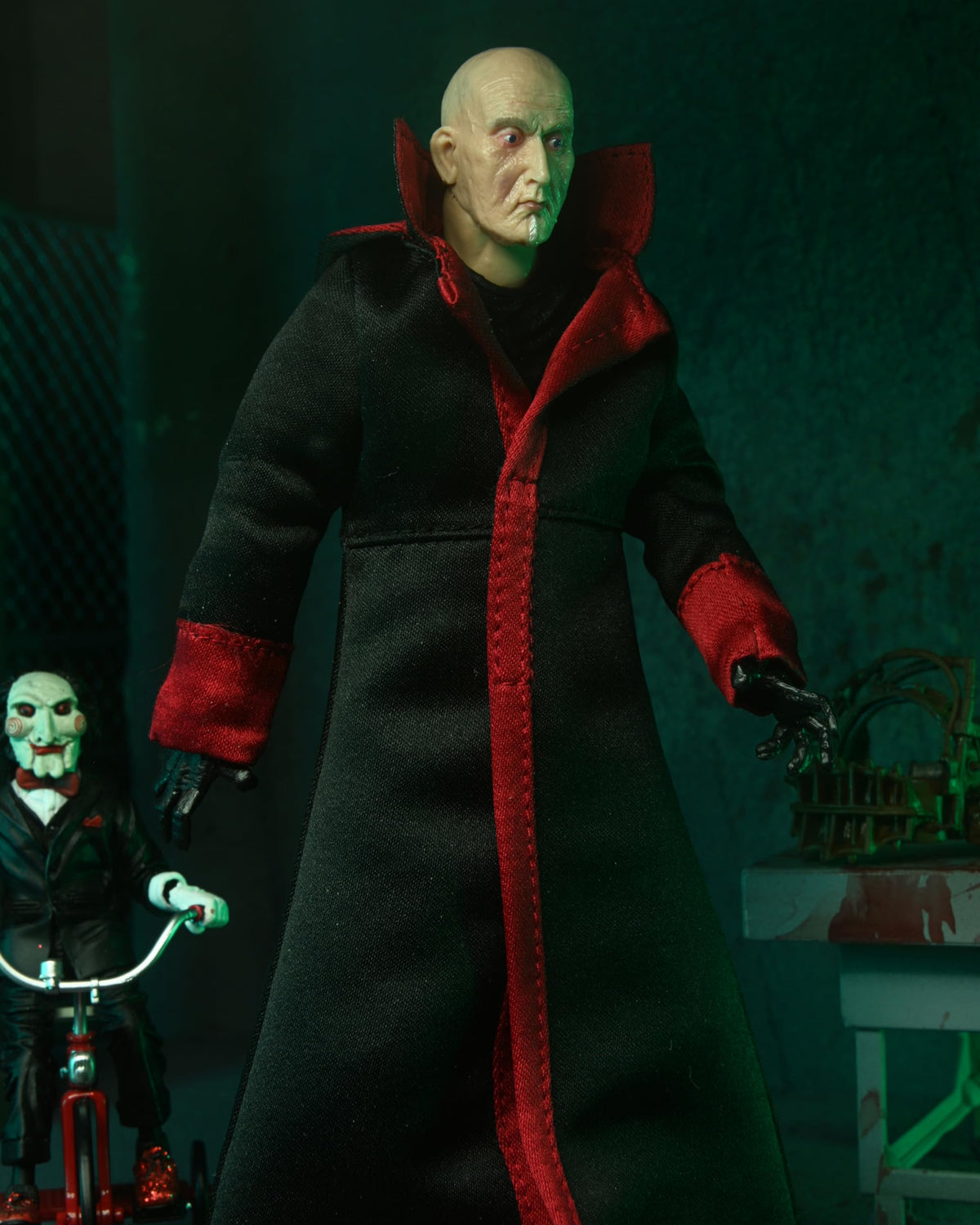 NECA pig-mask accessory adds authentic detail for Jigsaw display scenes.