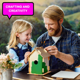 Neliblu two-pack birdhouse kit with ready-to-assemble pieces on a craft table.