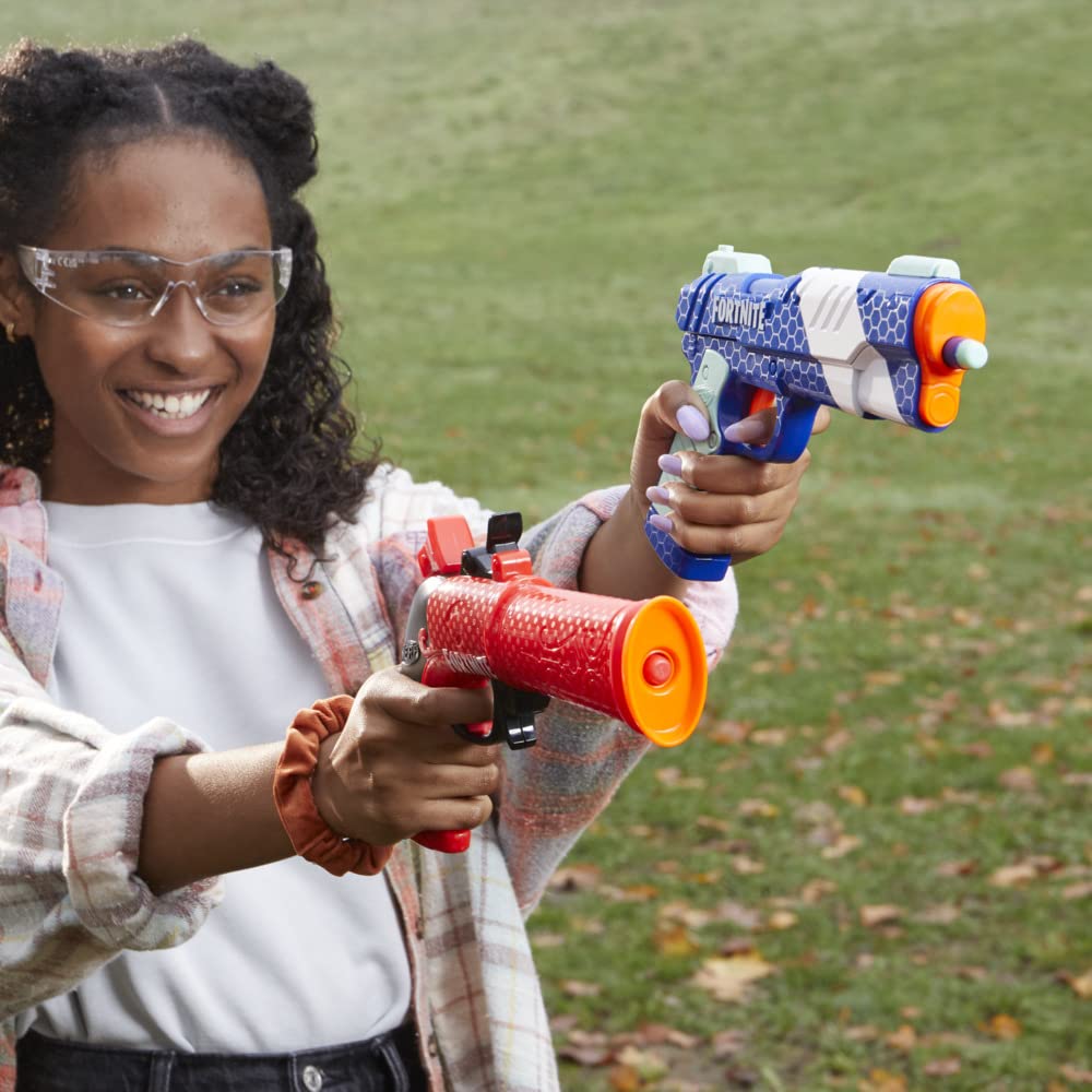 Nerf Elite darts six-pack included for rapid reloads during play.