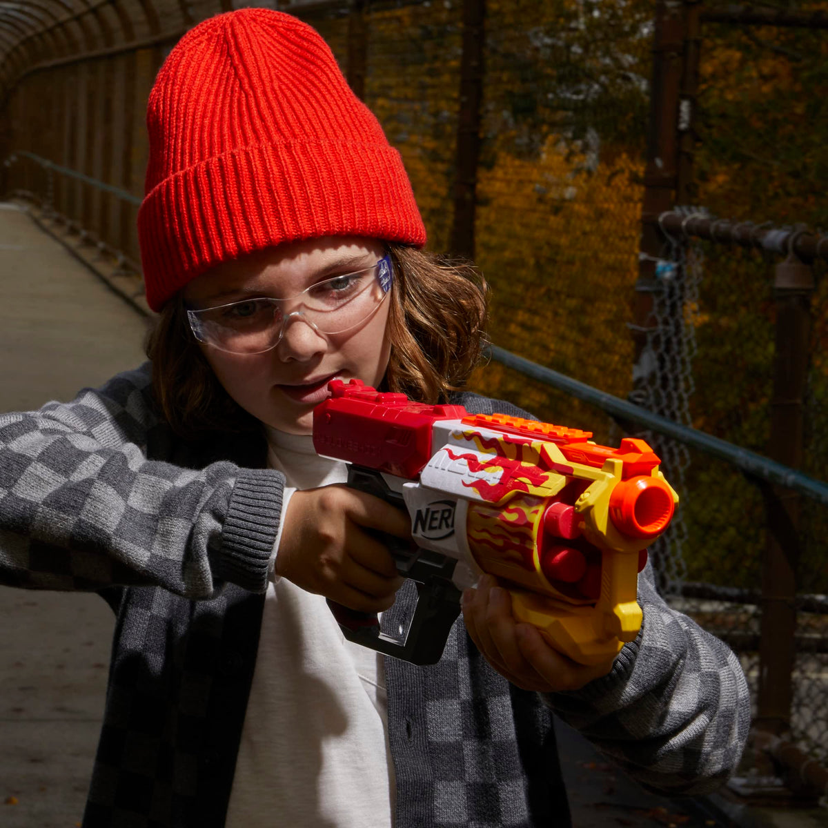 Outdoor battle scene featuring Nerf Mega CycloneShock Hotrod in action.