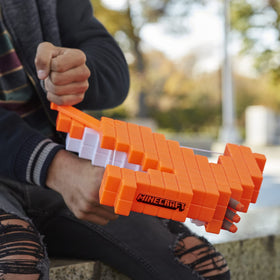 Nerf Minecraft Pillager's Crossbow three-dart barrel loading in progress.