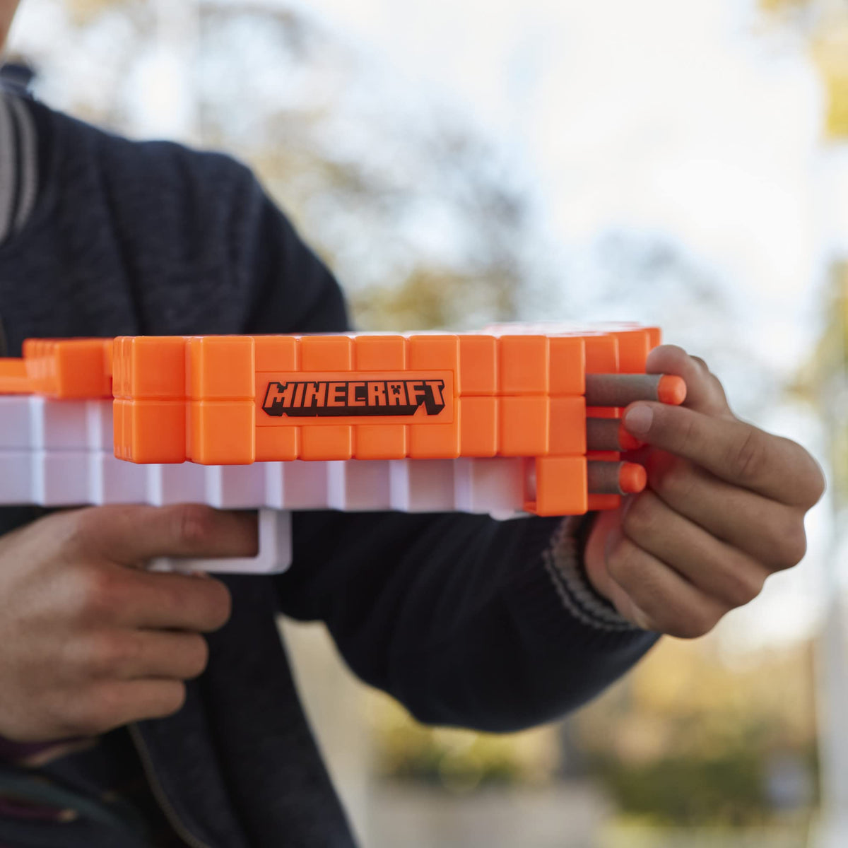 Nerf Minecraft Pillager's Crossbow loaded with three darts ready to fire.