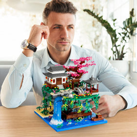 NEWABWN Cherry Bonsai Waterfall Display enhances desk or shelf aesthetics.