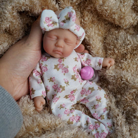Newtotlove portable mini baby doll set demonstrates compact, on-the-go companionship