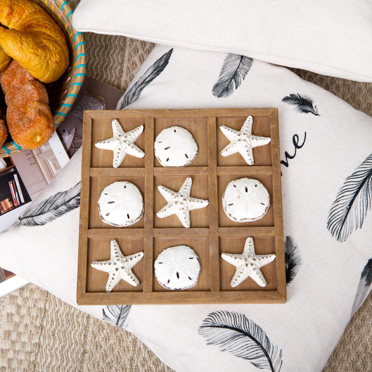 NIKKY HOME Beach Tic Tac Toe centerpiece on a coffee table, stylish focal point.