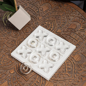 Close-up of polished acrylic X and O pieces from NIKKY HOME