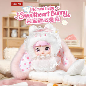 Nommi Baby Sweetheart Bunny blind box being opened for unboxing suspense.