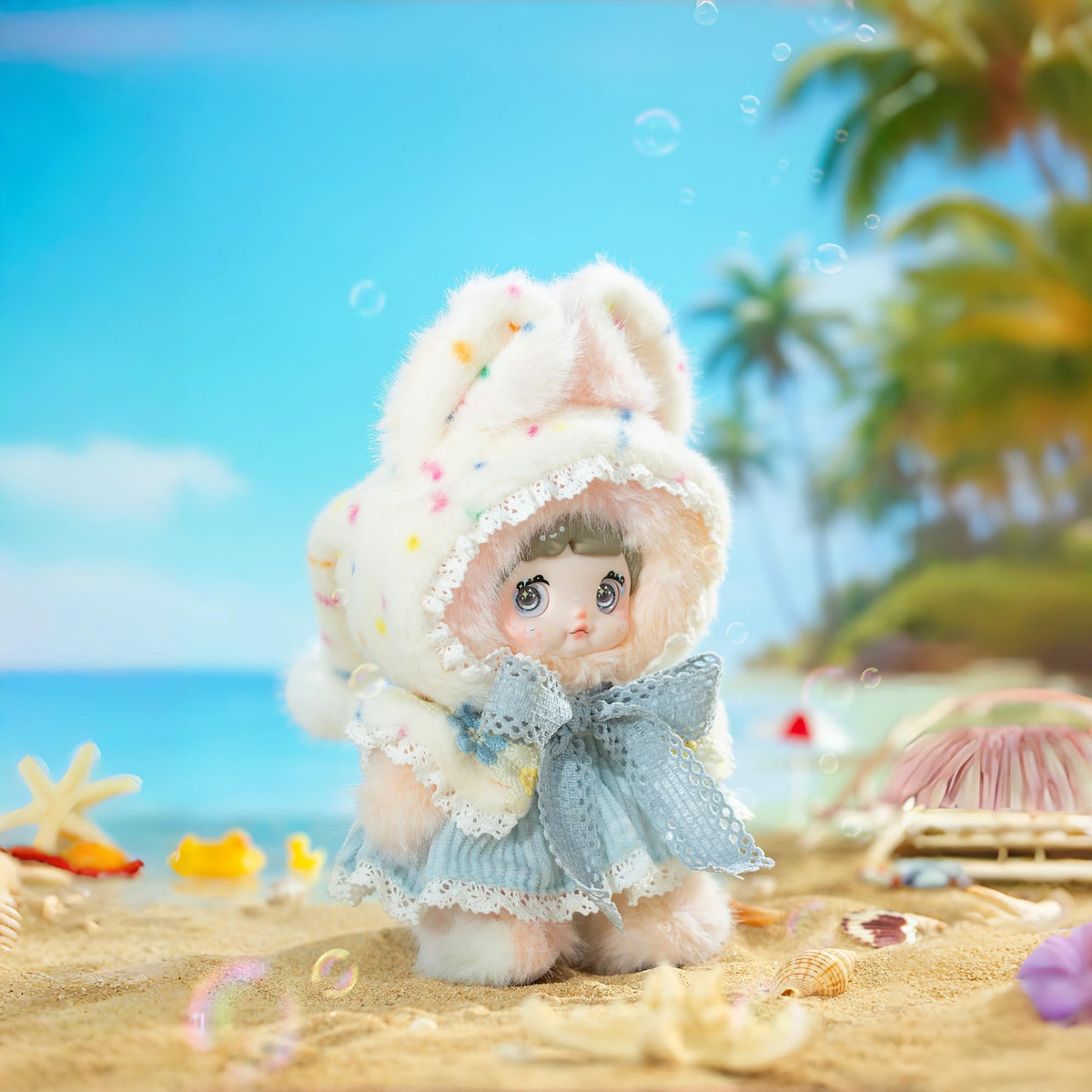Nommi rainbow-pastels plush with cloud pom-poms perfect for bedtime snuggles.