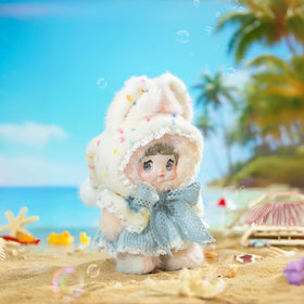 Nommi rainbow-pastels plush with cloud pom-poms perfect for bedtime snuggles.