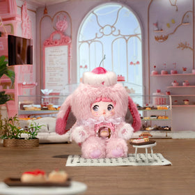 Nommi Sweetheart plush with movable eyes in playful poses.