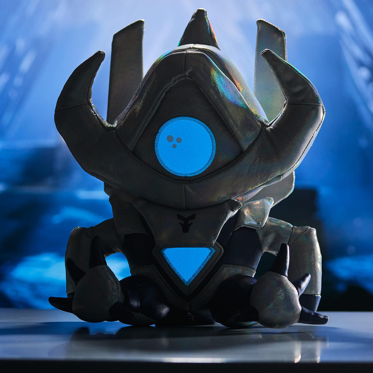 Aetheon plush eye glows in the dark for a cosmic accent.