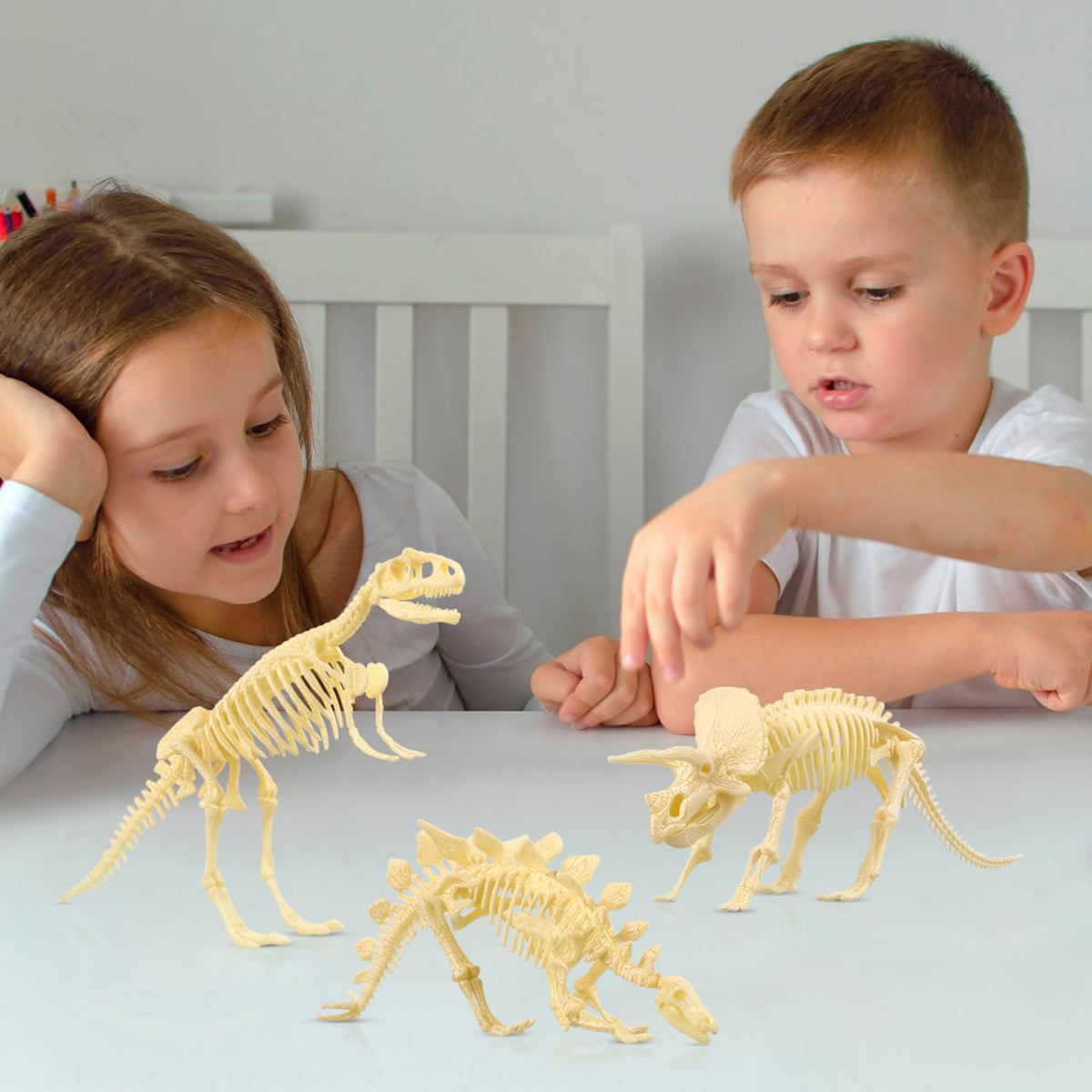 NUOLUX dino-dig in sand scene invites outdoor exploration.