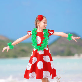 Obavioy leis bracelets pair with the dress for a complete tropical look