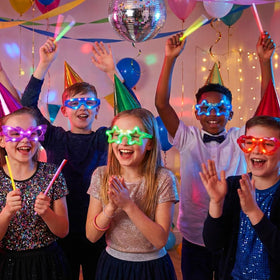 OceanWings 24-pack LED glasses worn at a kids party