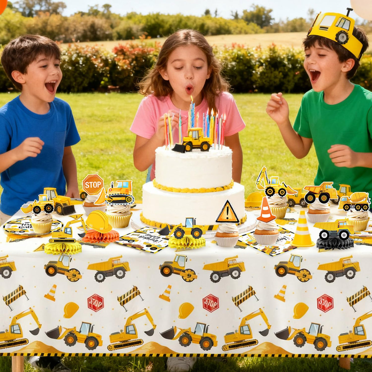 Oigco hanging swirls and cake toppers create playful construction accents.