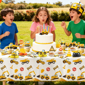 Oigco hanging swirls and cake toppers create playful construction accents.