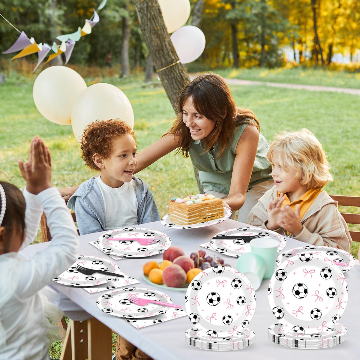 Oitnlaughter sports themed decor with pink bows enhances party ambiance