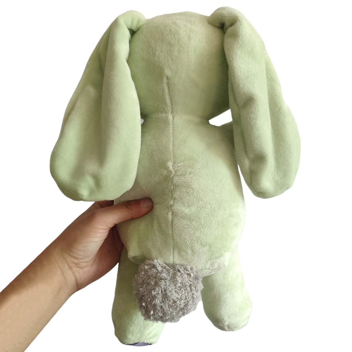 Okidg Knuffle Bunny plush on shelf adds charm and character to any room.