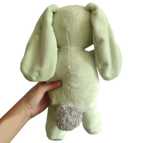 Okidg Knuffle Bunny plush on shelf adds charm and character to any room.