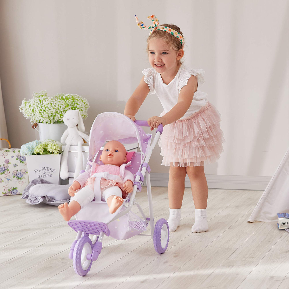 Olivia's Little World stroller with seatbelt promotes safe pretend adventures.