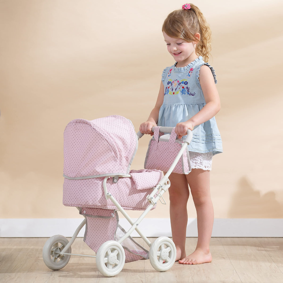 Olivia's Little World stroller with retractable canopy for shaded pretend play.