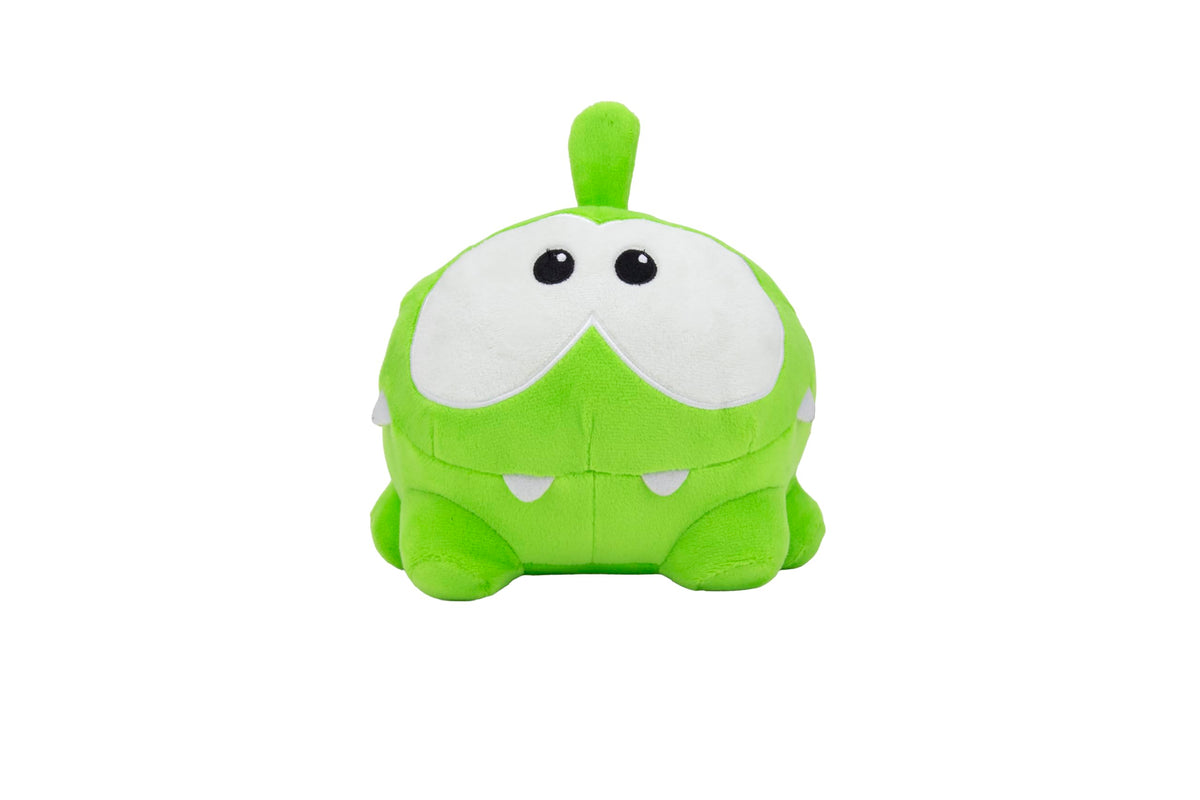 Om Nom plush toy side view, showing soft fur for cozy bedtime hugs.