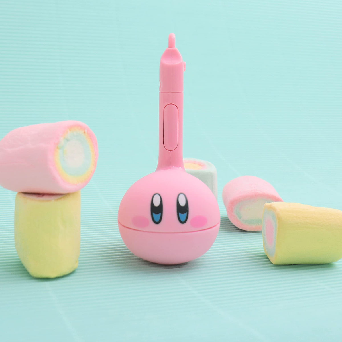 Otamatone Melody keychain attachment shown for portable music on the go.