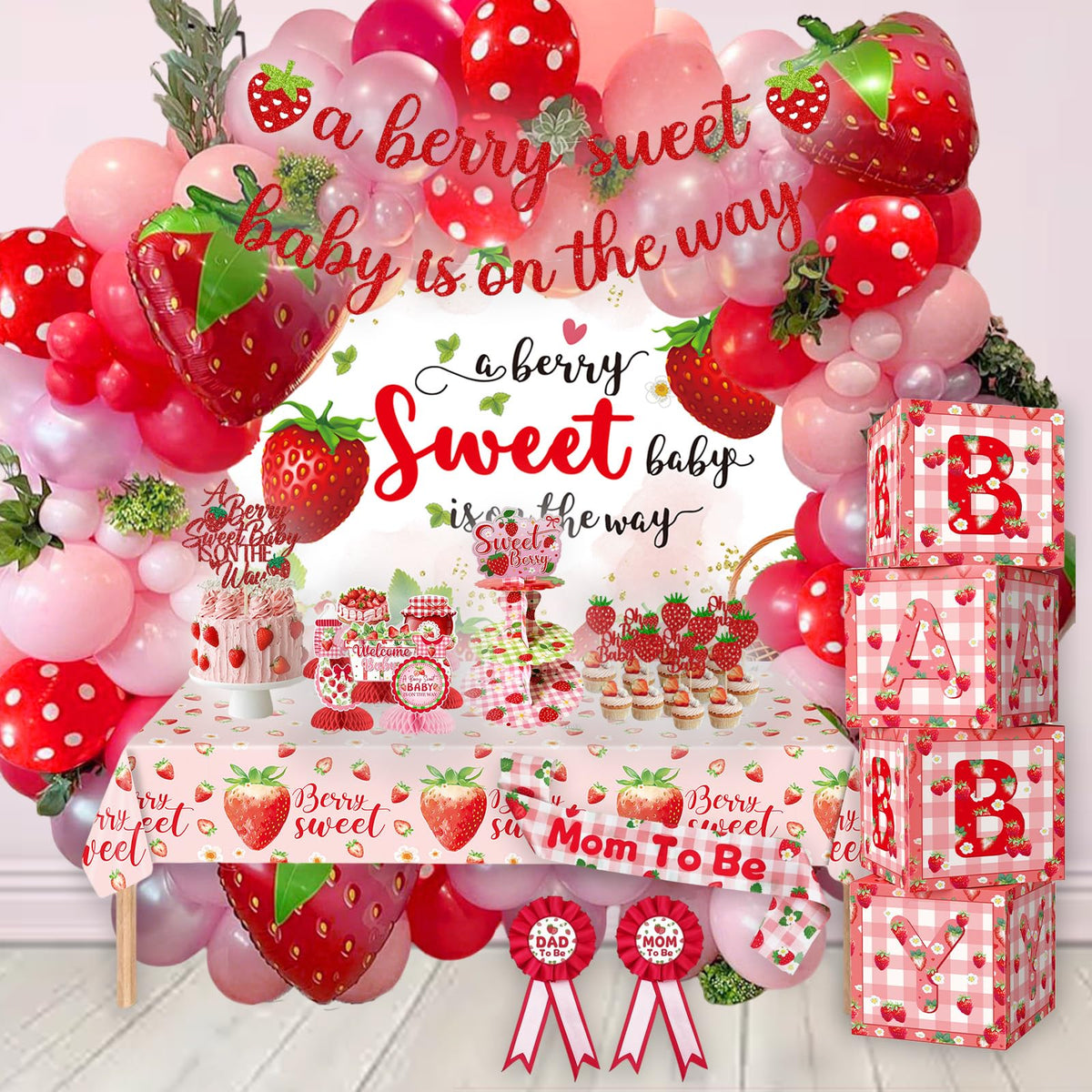 OUNIY strawberry backdrop enhances the baby shower with a bold focal point