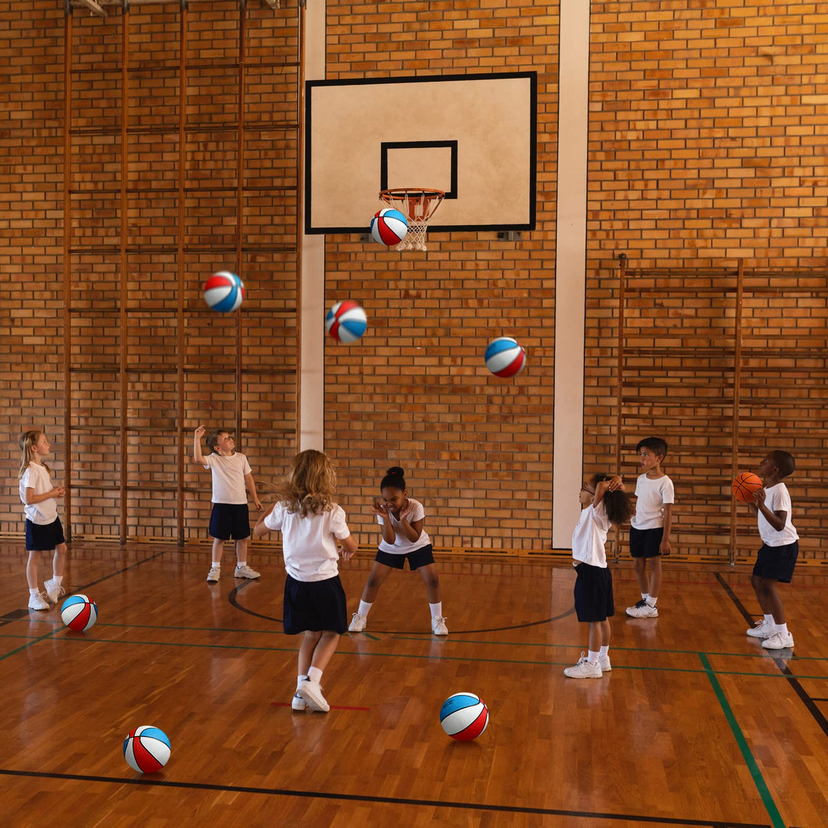 Outus junior-size balls support beginners practicing dribbling and shooting.