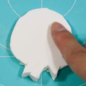 PADICO Air Dry Stone LA Doll Premix Sculpting demonstrates smooth carving for facial features.