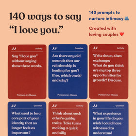 Spread of activity cards on a table for playful bonding during date night.