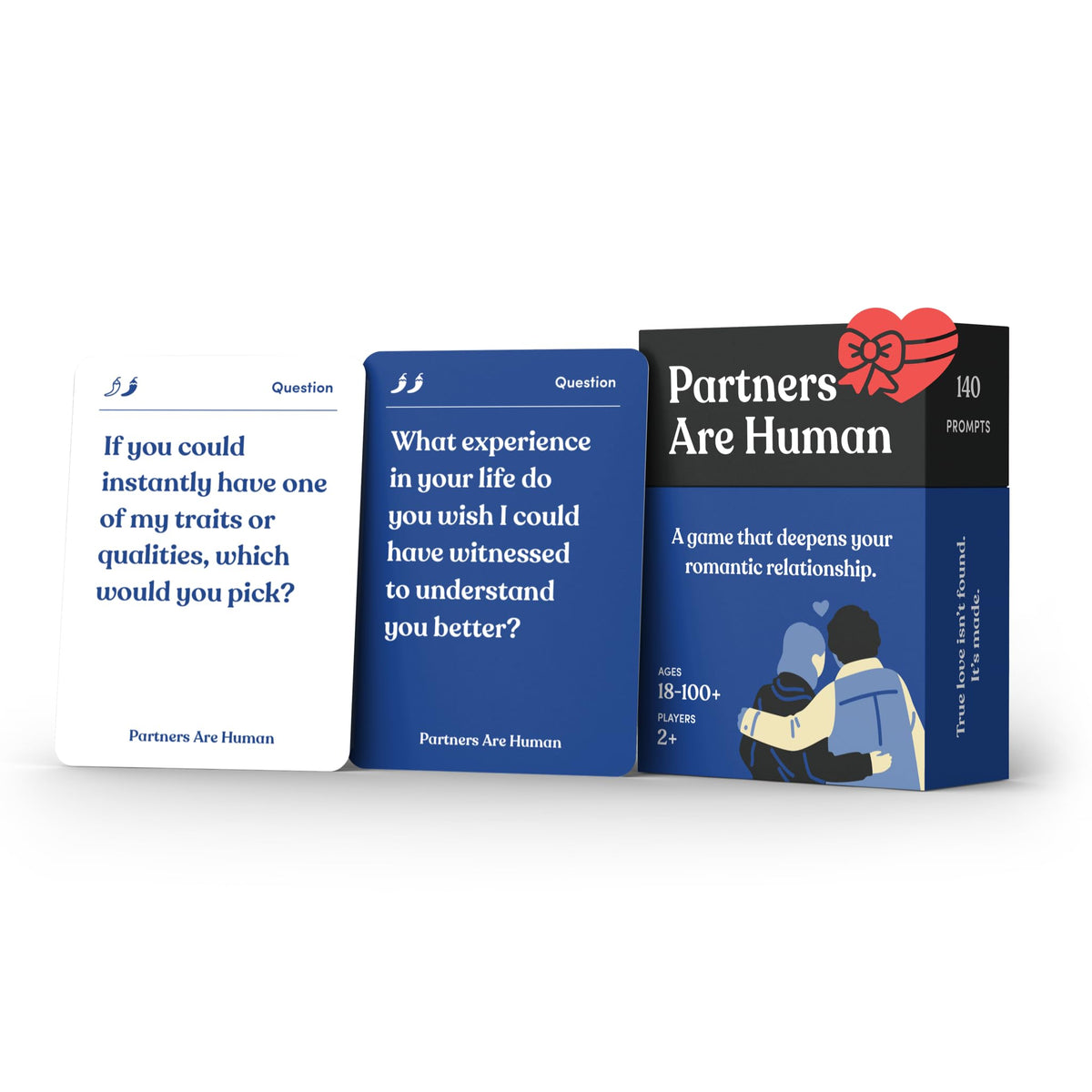 Partners Are Human card game box on a coffee table inviting intimate conversation.