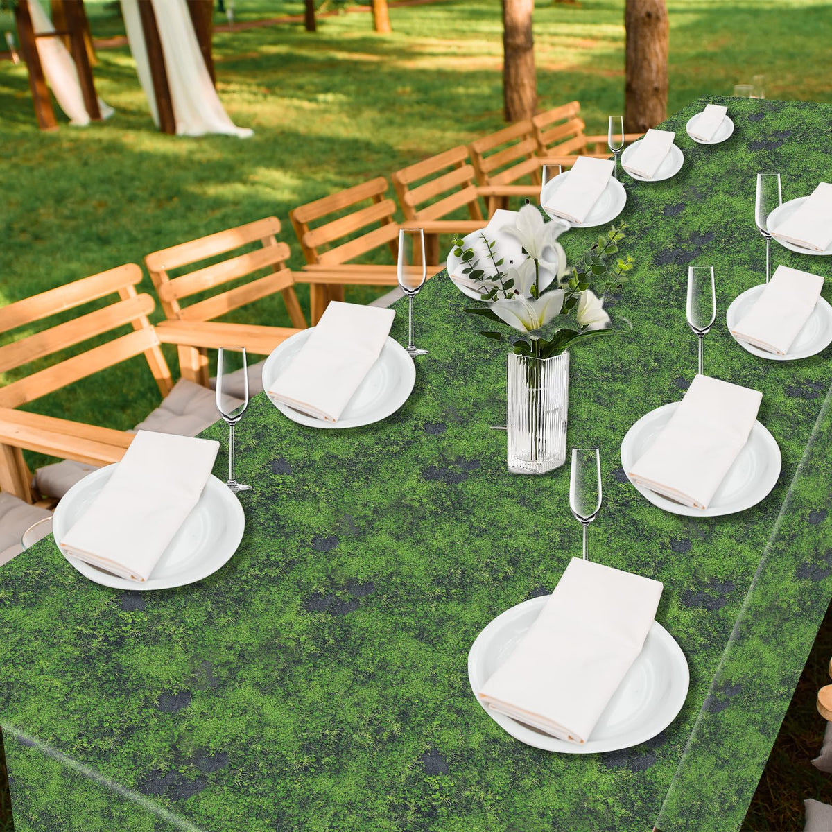 Party Greeting green moss backdrop setup for photos enhances jungle-themed party visuals.