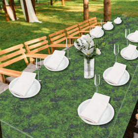 Party Greeting green moss backdrop setup for photos enhances jungle-themed party visuals.
