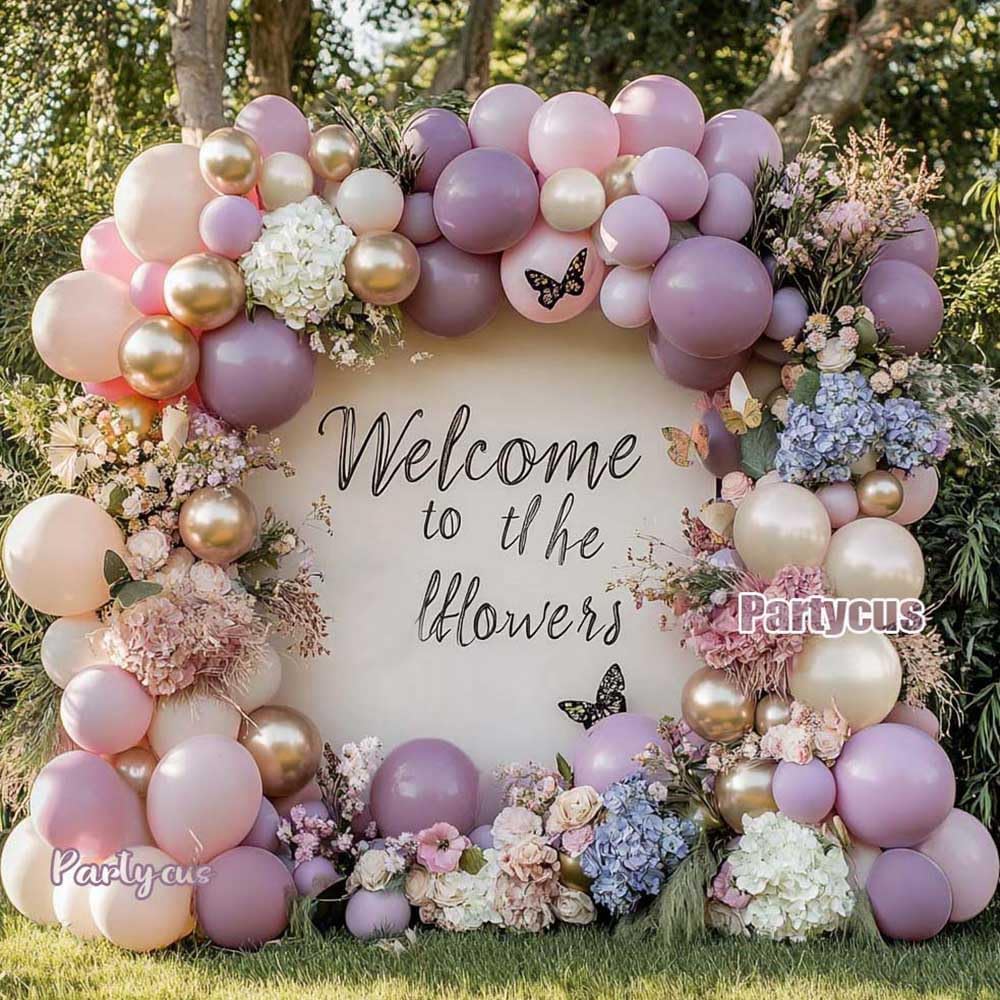 Partycus baby shower arch setup idea using dusty lavender and pink tones.