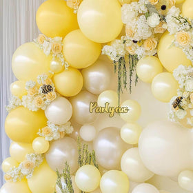 Partycus double-stuffed 12-inch yellow and white balloons create a lush garland.