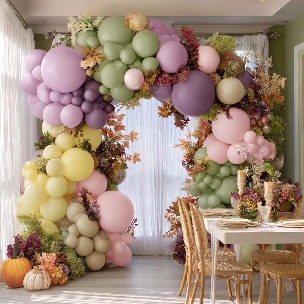 Partycus pastel yellow 5in balloons add subtle pops to the arch.