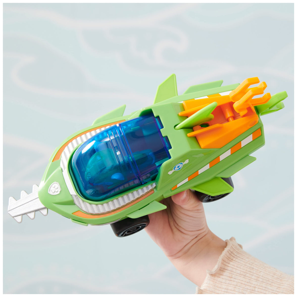 Paw Patrol Aqua Pups Rocky figure in green wetsuit enables authentic rescue adventures.