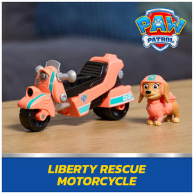 Paw Patrol Liberty figure securely attaches to motorcycle for realistic play.