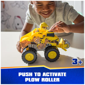 PAW Patrol Rubble figure perched in the driver seat for instant rescue missions.