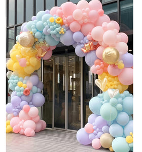 PAXILE mini 5-inch balloons add subtle color accents to arches.