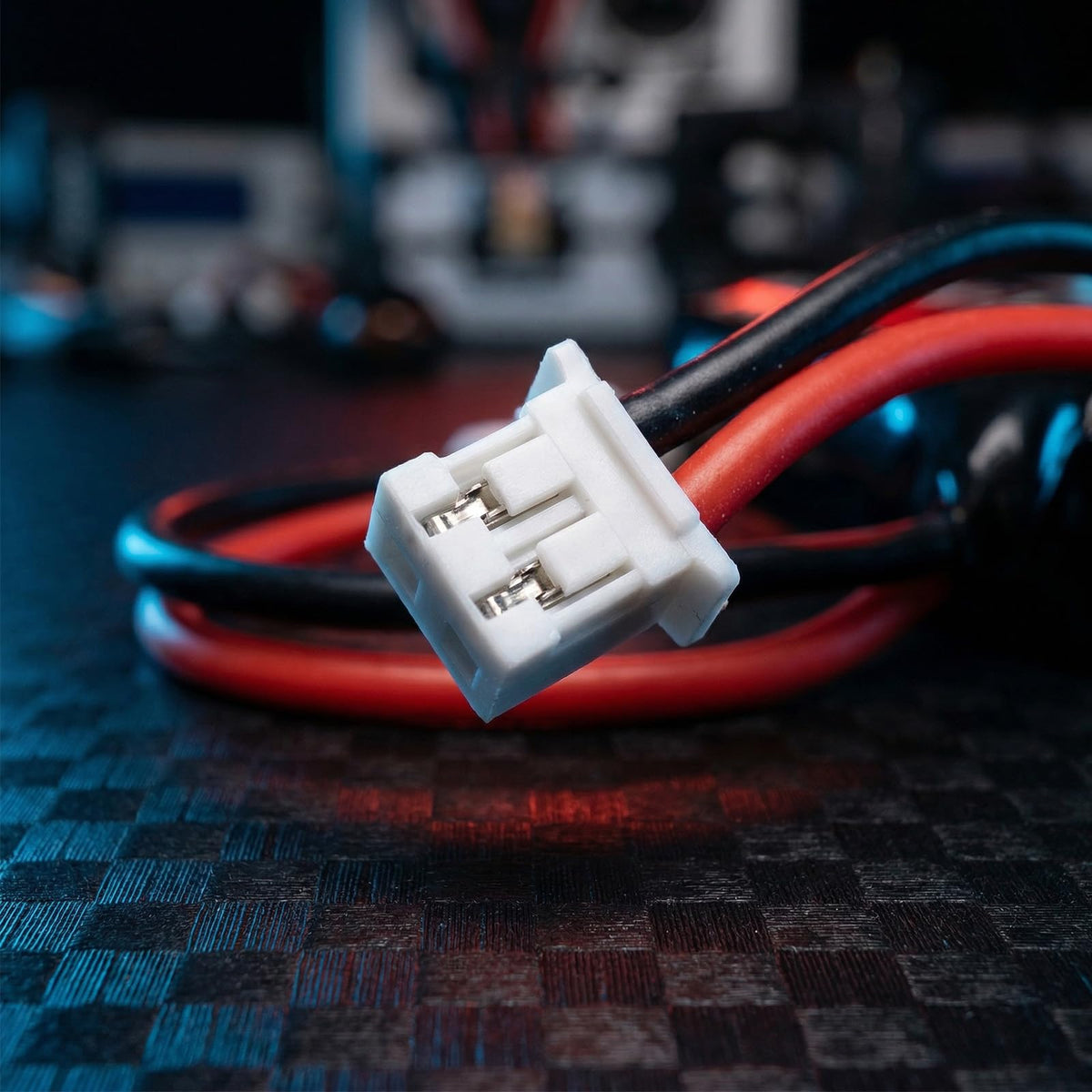 PCEONAMP battery shown beside charger cable for convenient top-ups