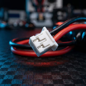 PCEONAMP battery shown beside charger cable for convenient top-ups