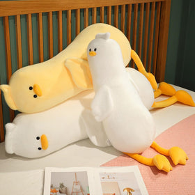 PEACH CAT yellow duck plush beside a chair for comforting companionship