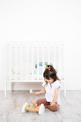Pearhead hammer bench compact size fits small play spaces.